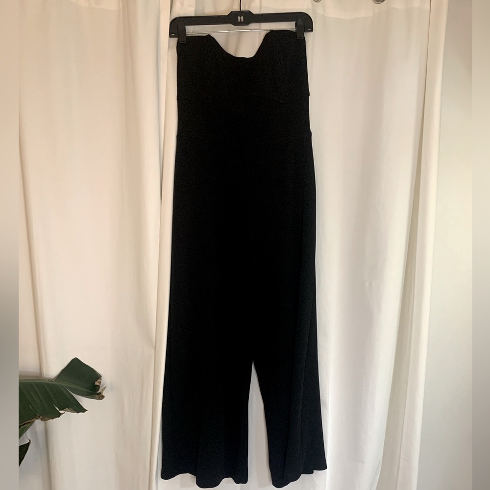 Black strapless jumper with wide legs. Size Medium.